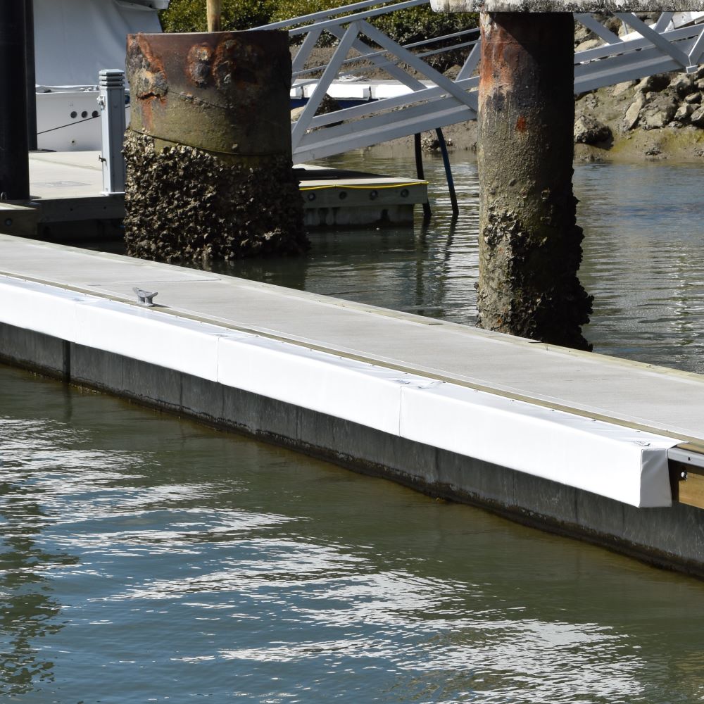 Contoured Barrier Fenders available from Hauraki Fenders - 2m pvc covered foam marina fender shaped to fit around a marina berth rub strip